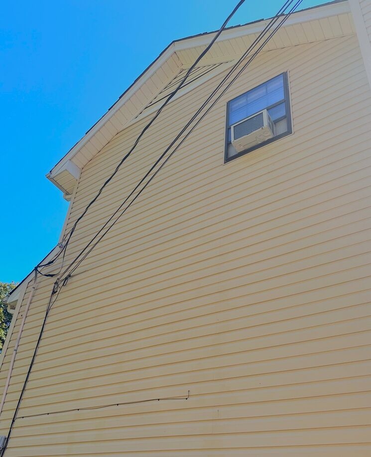 After photo of a low-pressure soft washing on vinyl siding to safely remove mold and dirt for Pressure Washing McCalla Alabama.
